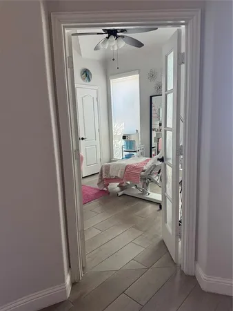 a bedroom with a bed and a mirror