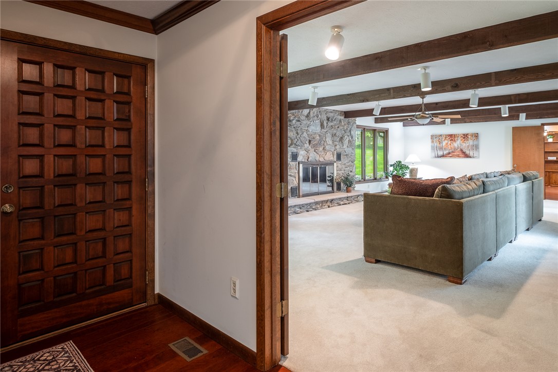 273 North Alpha Bellbrook Road Dayton, OH 45434 - Photo 6 of 43 Step inside this inviting home featuring a stone fireplace and elegant hardwood flooring.