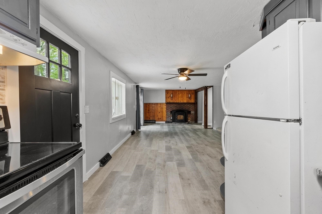 258 Allen Road Ashby, MA 01431 - Photo 11 of 36 a view of livingroom with a fireplace