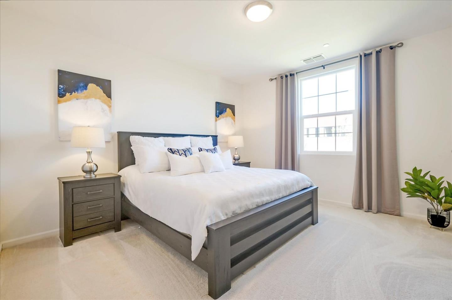 39846 Sawyer Terrace Newark, CA 94560 - Photo 12 of 21 a bed sitting in a bedroom next to a window