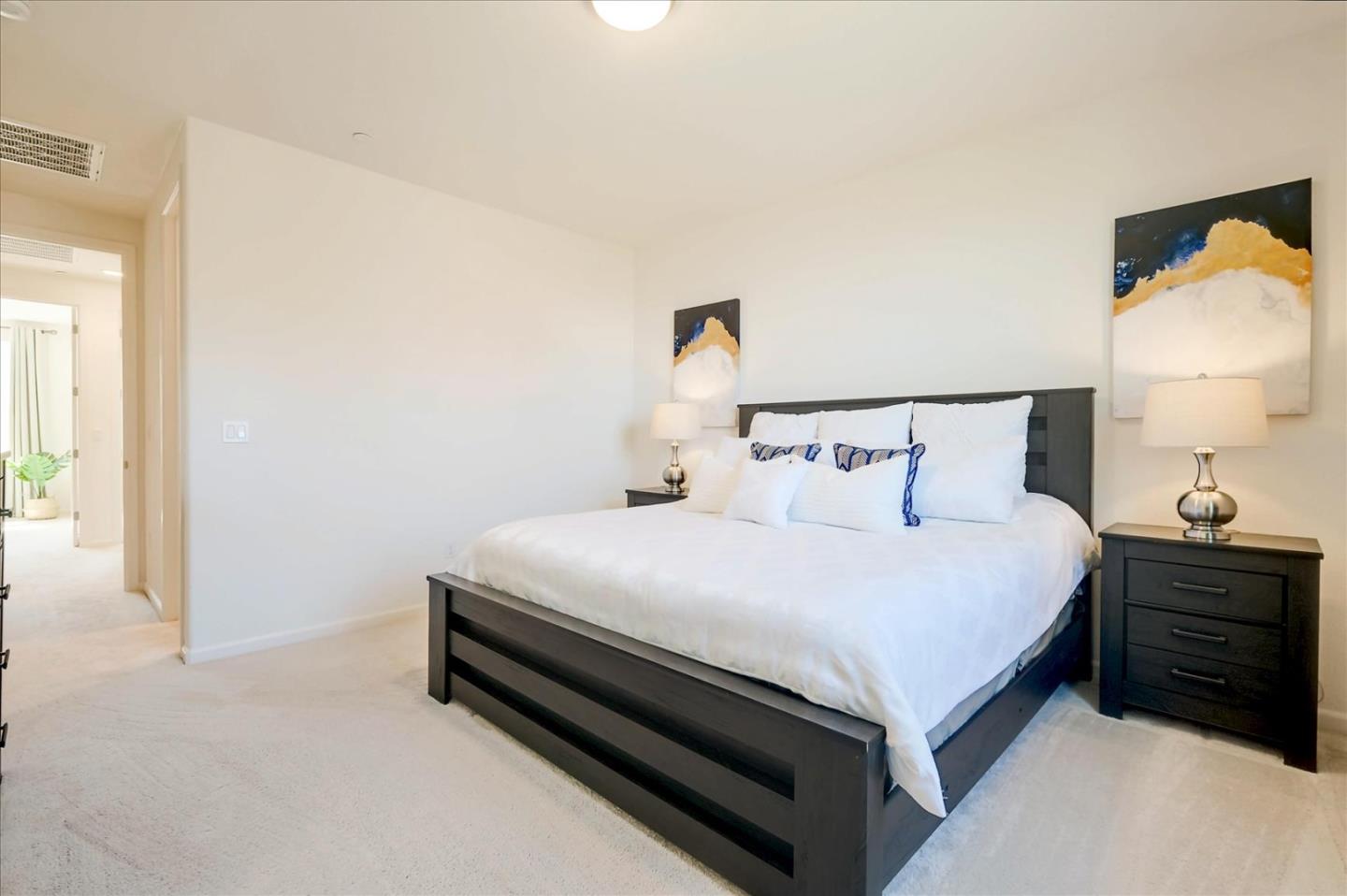 39846 Sawyer Terrace Newark, CA 94560 - Photo 13 of 21 a bedroom with a bed and a lamp