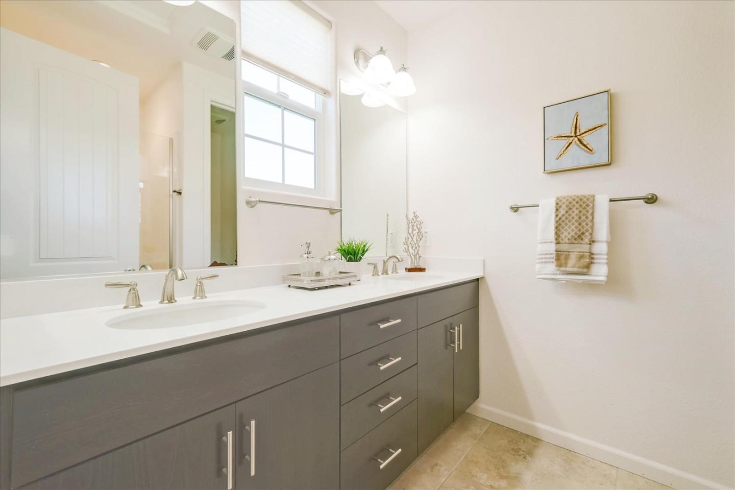 39846 Sawyer Terrace Newark, CA 94560 - Photo 14 of 21 a bathroom with a double vanity sink and a mirror