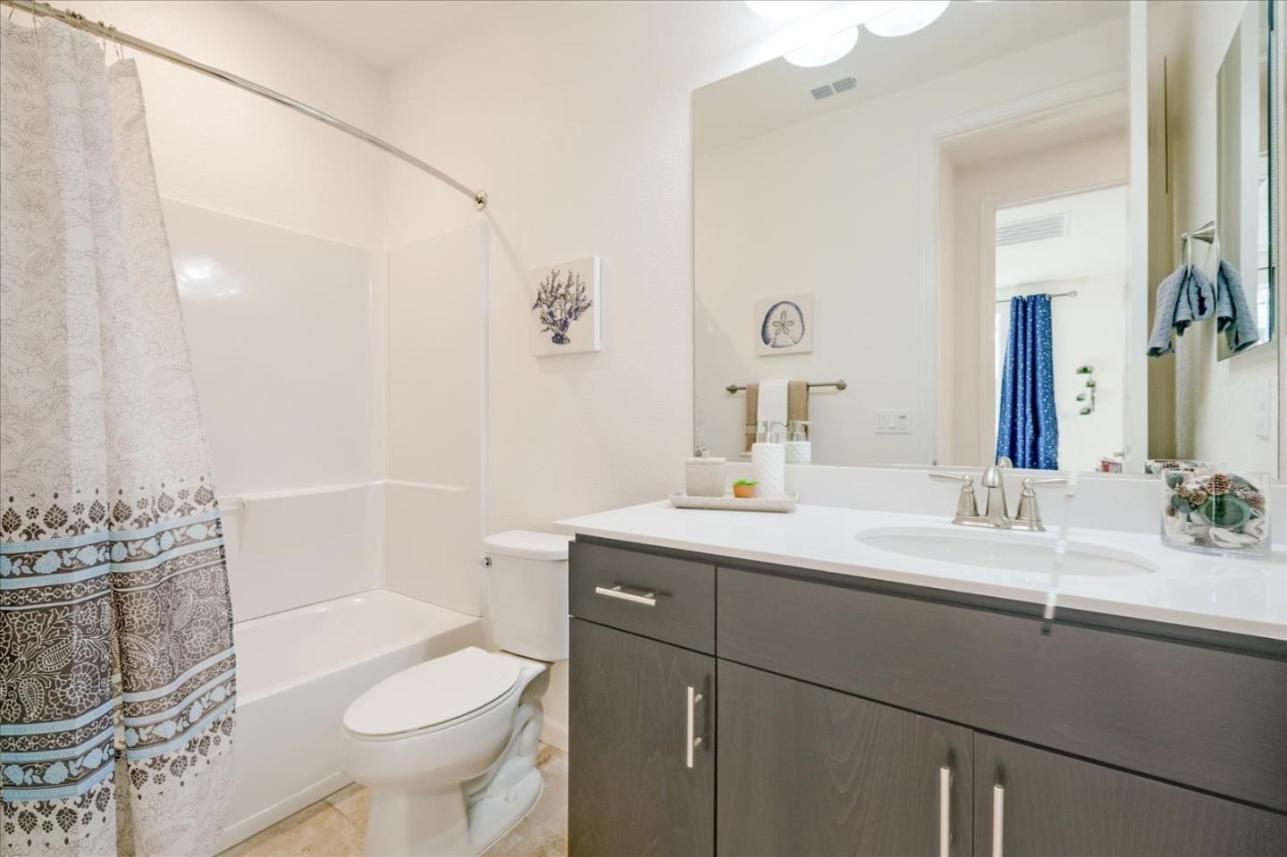 39846 Sawyer Terrace Newark, CA 94560 - Photo 16 of 21 a bathroom with a sink toilet vanity and tub