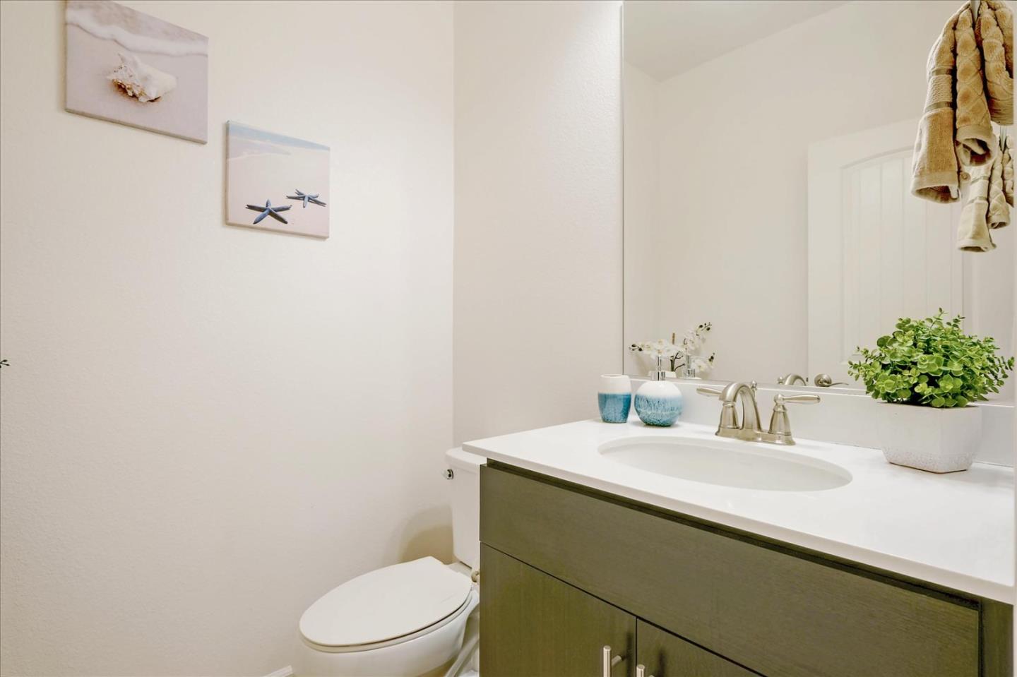 39846 Sawyer Terrace Newark, CA 94560 - Photo 9 of 21 a bathroom with a sink a toilet and mirror
