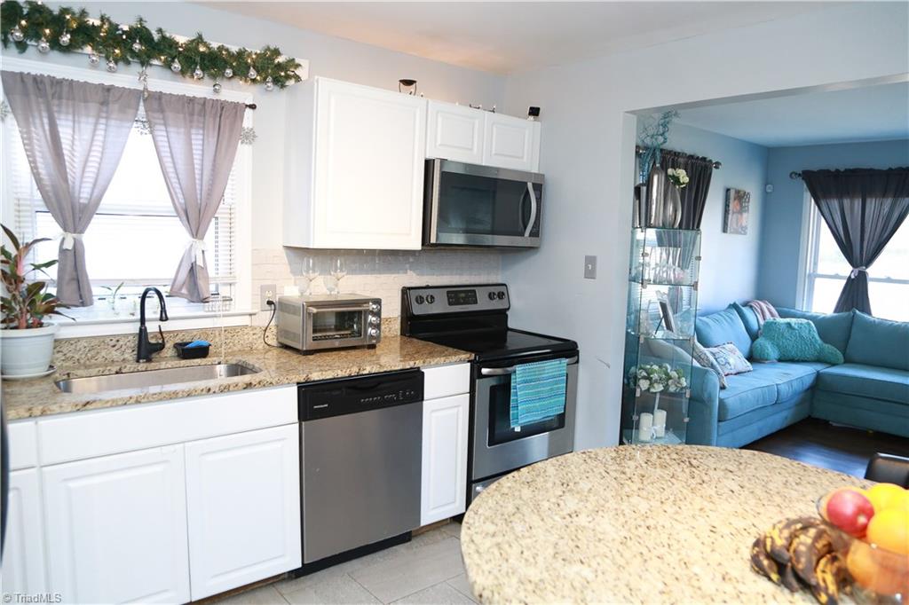 2012 Armhurst Road Greensboro, NC 27405 - Photo 7 of 23 Kitchen with granite and stainless steel appliances