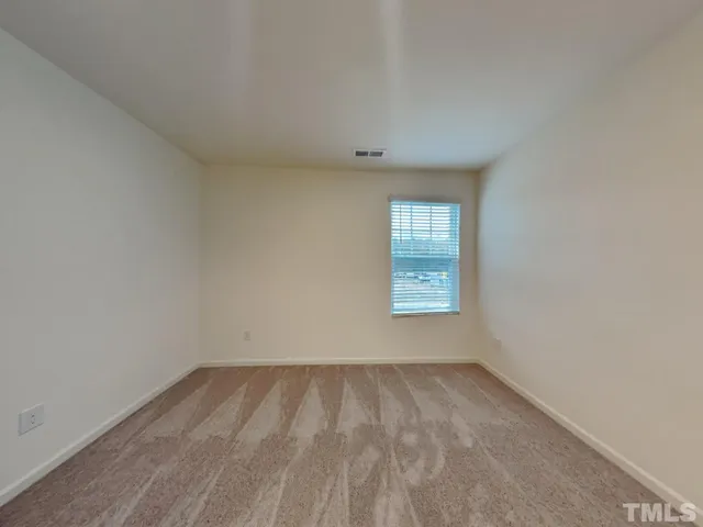a white toilet and tub sitting next to a bathroom sink
