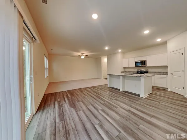 a view of kitchen with sink microwave and stove