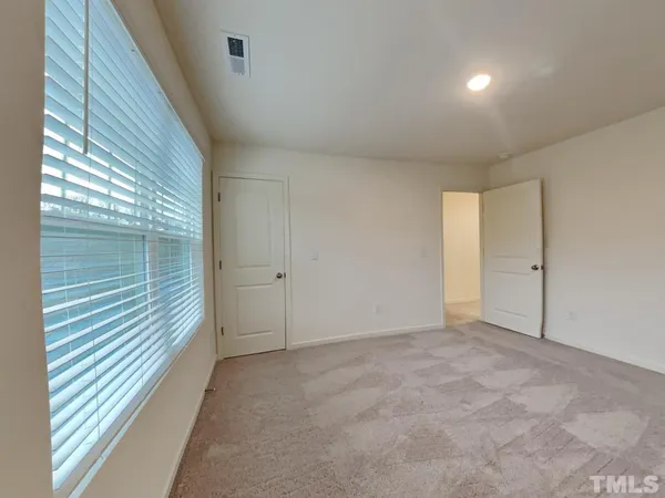 a bathroom with a sink a toilet a mirror a bathtub and shower