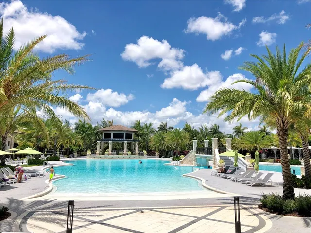 a view of a swimming pool with a patio