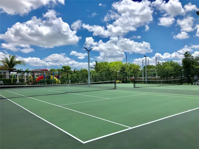 a view of an outdoor space and tennis court