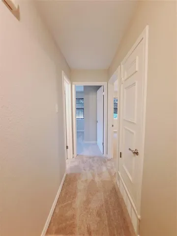 an empty room with a empty space and a ceiling fan