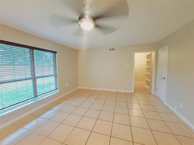 a view of a kitchen with a sink and cabinets