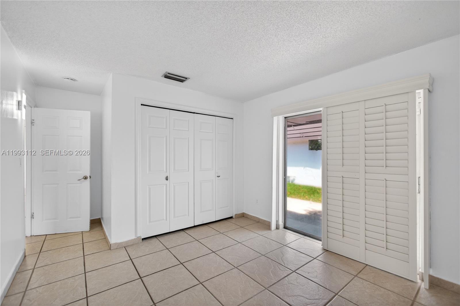 13471 Southwest 99th Terrace Miami, FL 33186 - Photo 32 of 44 a view of an empty room and window