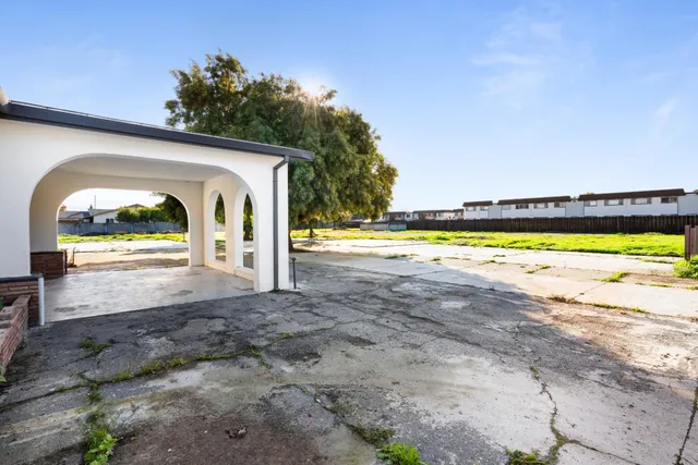 a view of a water heater and a big yard