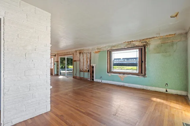 a view of livingroom with hardwood floor and window