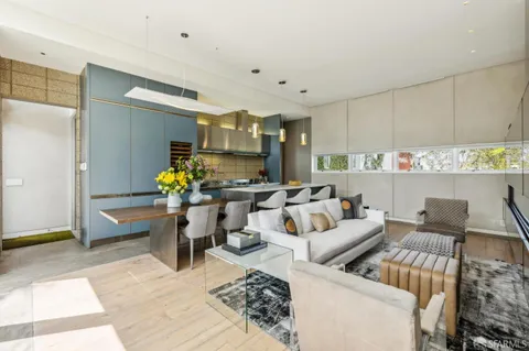 a kitchen with a table and chairs