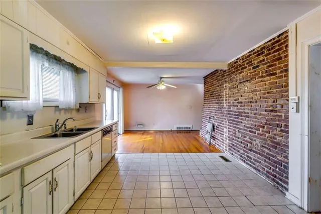 a kitchen with a sink and cabinets
