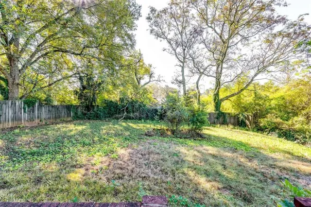 a view of a house with a big yard
