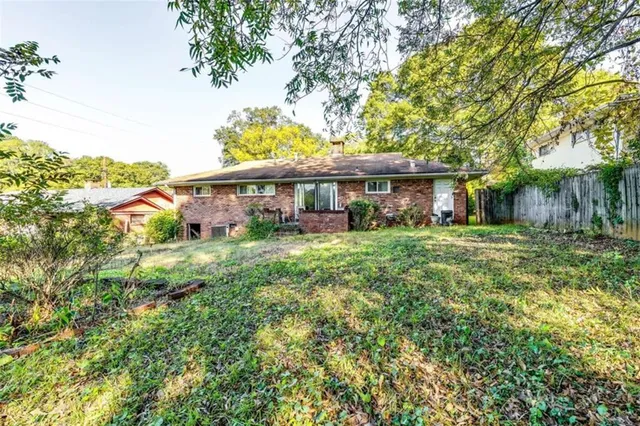 a view of a yard and front view of a house