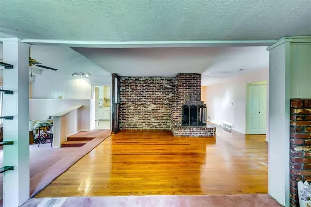 a view of living room with furniture and flat screen tv