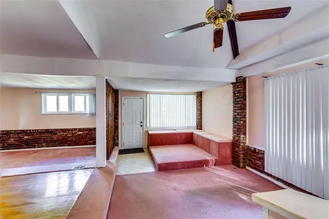 a bedroom with furniture and window