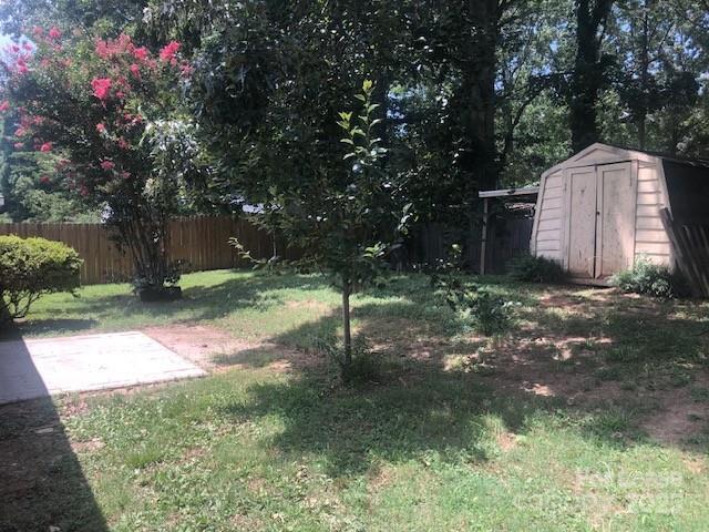 5904 White Cliffs Drive Monroe, NC 28110 - Photo 14 of 16 a backyard of a house with lots of green space