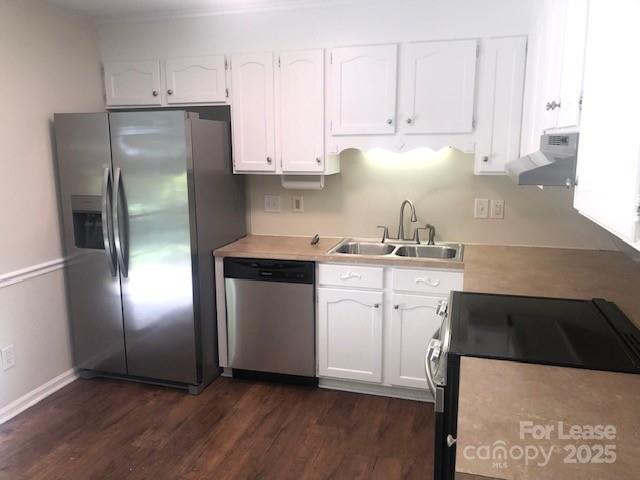 5904 White Cliffs Drive Monroe, NC 28110 - Photo 2 of 16 a kitchen with stainless steel appliances kitchen island granite countertop a refrigerator sink and white cabinets
