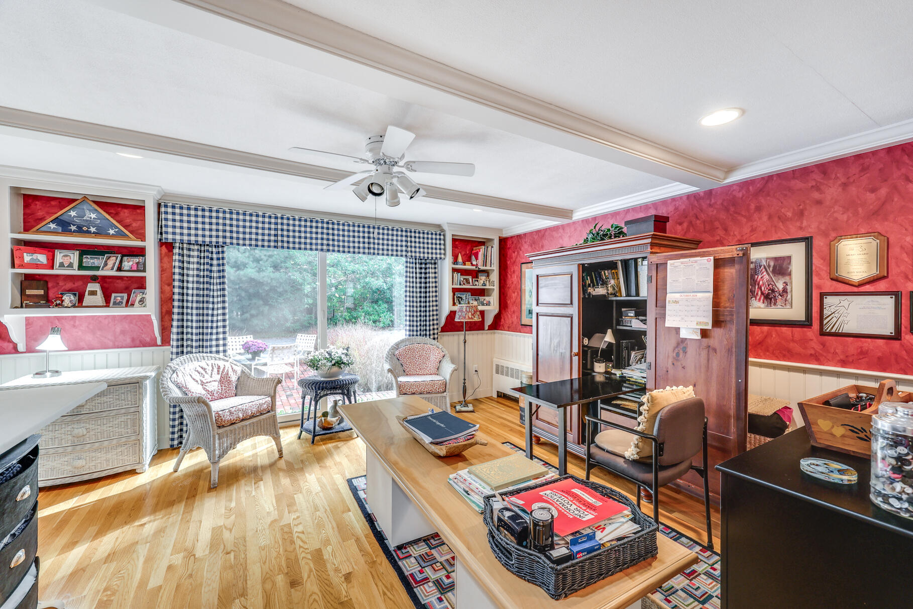 49 Fire Station Road Osterville, MA 02655 - Photo 15 of 32 a living room with furniture a flat screen tv and a floor to ceiling window