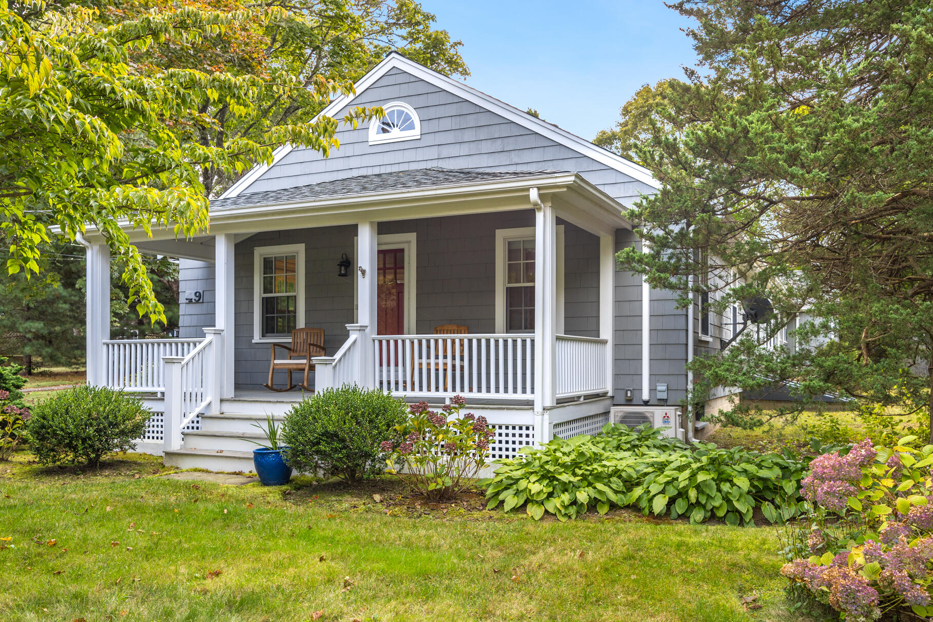 49 Fire Station Road Osterville, MA 02655 - Photo 2 of 32 a view of a house with a small yard and plants