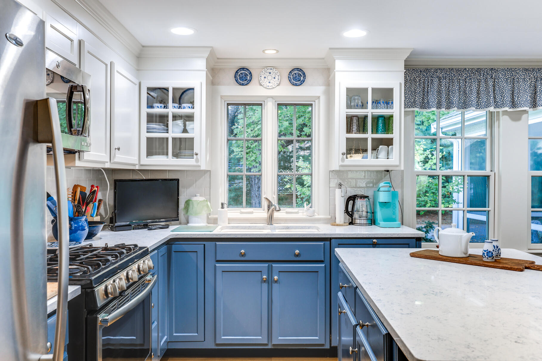 49 Fire Station Road Osterville, MA 02655 - Photo 10 of 32 a kitchen with a stove a sink and a refrigerator