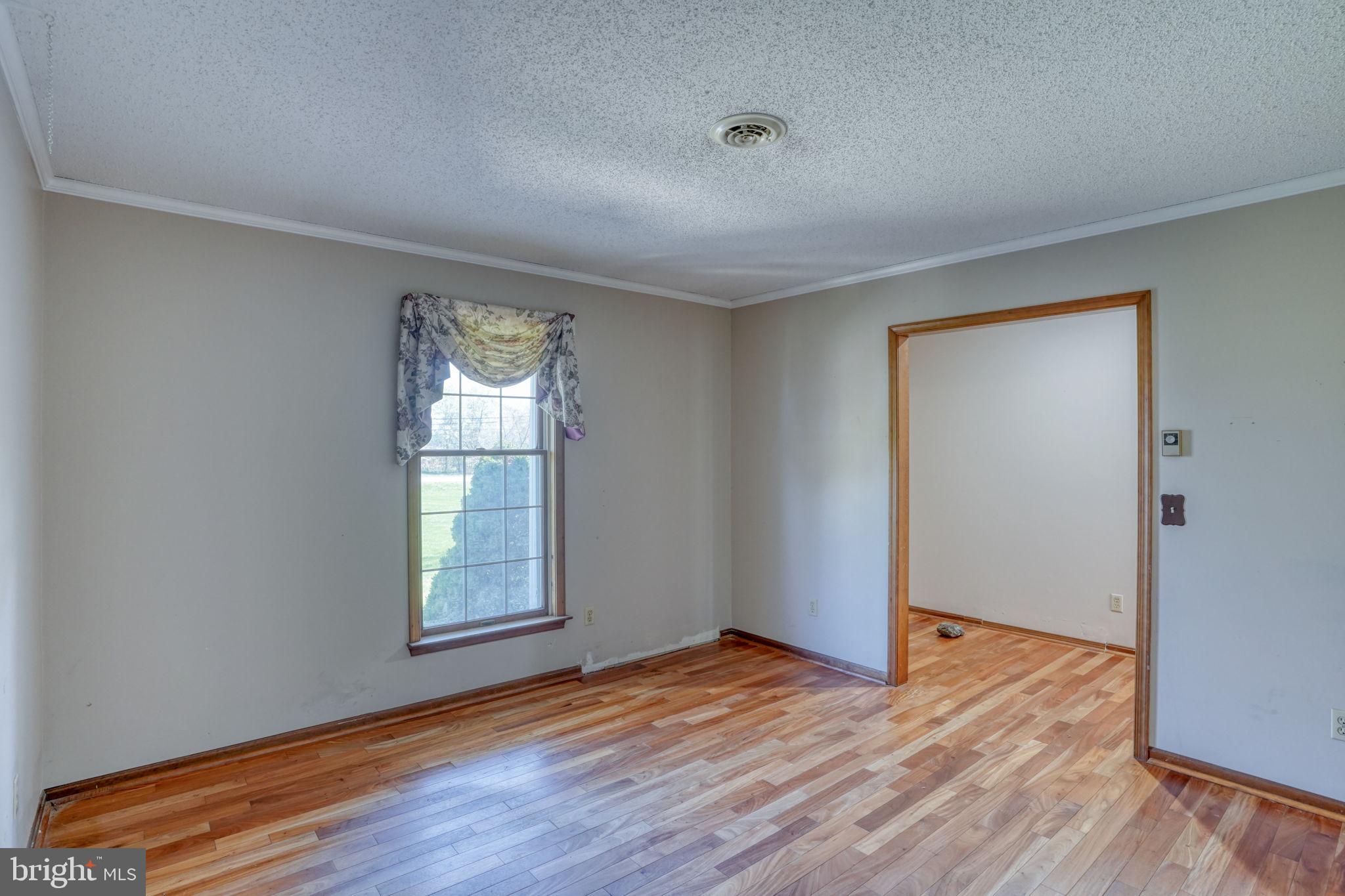 102 Green Giant Road Townsend, DE 19734 - Photo 20 of 43 Bright, airy space with hardwood floors.