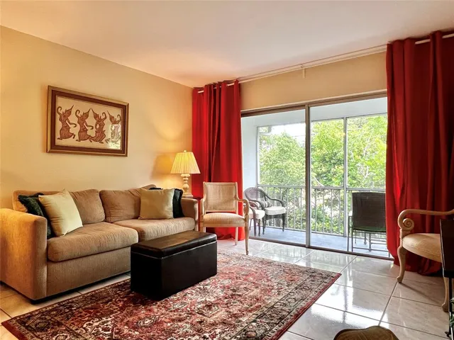a living room with furniture and a rug