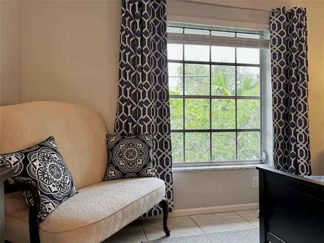 a living room with a couch and a window