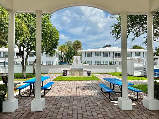 a potted plant sitting in front of a house