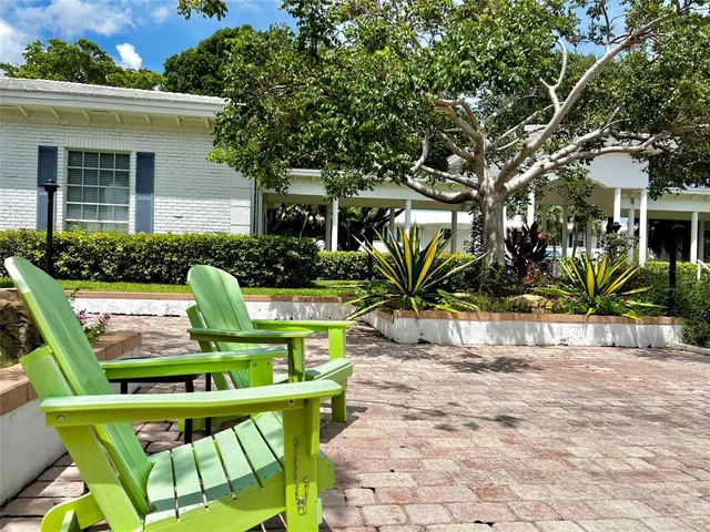 a view of a chairs and table in the patio