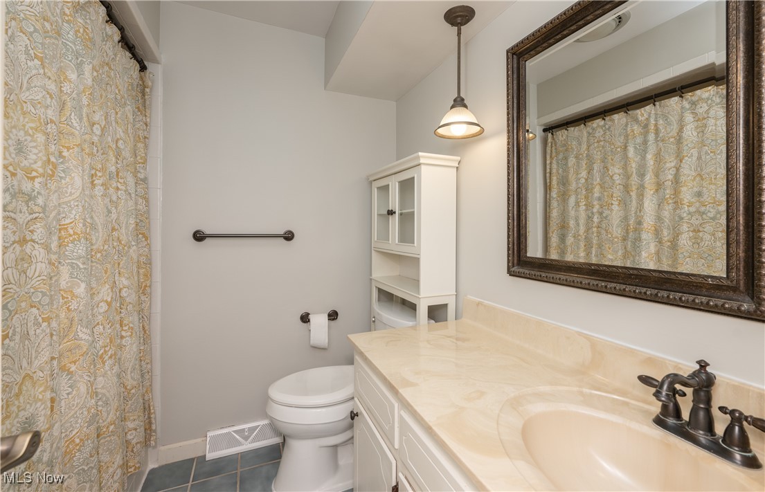 3721 20th Street Northwest Canton, OH 44708 - Photo 10 of 47 Bathroom with vanity, tile patterned floors, and toilet