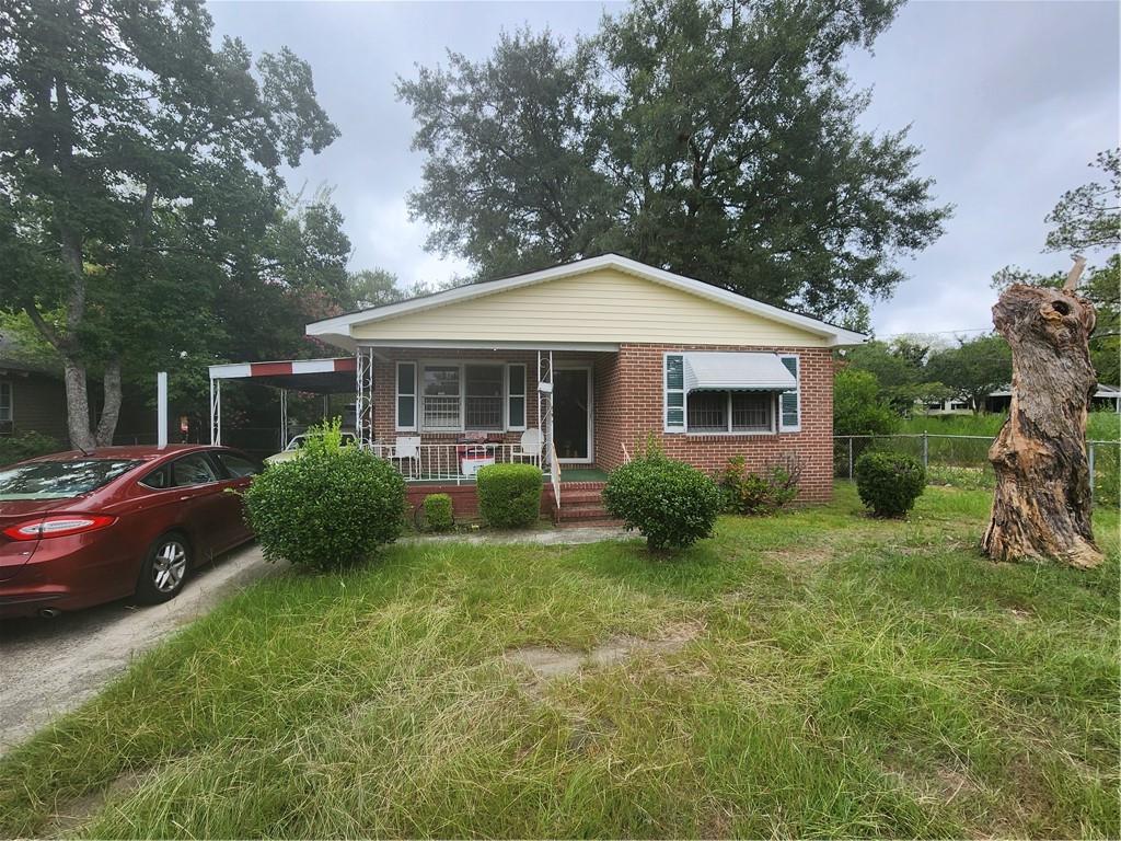 4280 Bloomfield Road Macon, GA 31206 - Photo 1 of 1 a front view of a house with garden