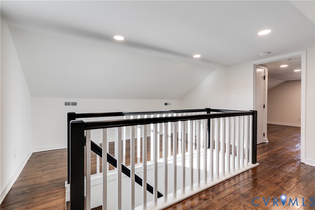 2207 Rawlings Street Henrico, VA 23231 - Photo 19 of 28 a view of staircase with railing and a rug