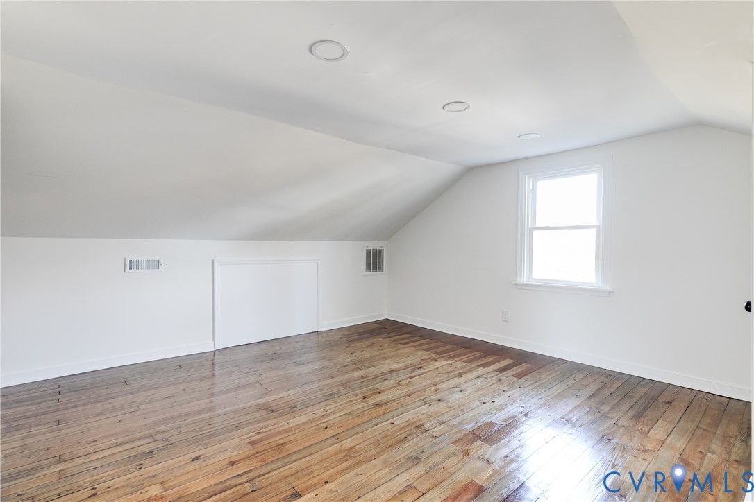 2207 Rawlings Street Henrico, VA 23231 - Photo 21 of 28 an empty room with wooden floor and windows