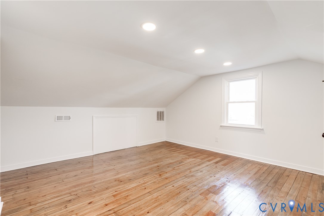 2207 Rawlings Street Henrico, VA 23231 - Photo 23 of 28 an empty room with wooden floor and windows