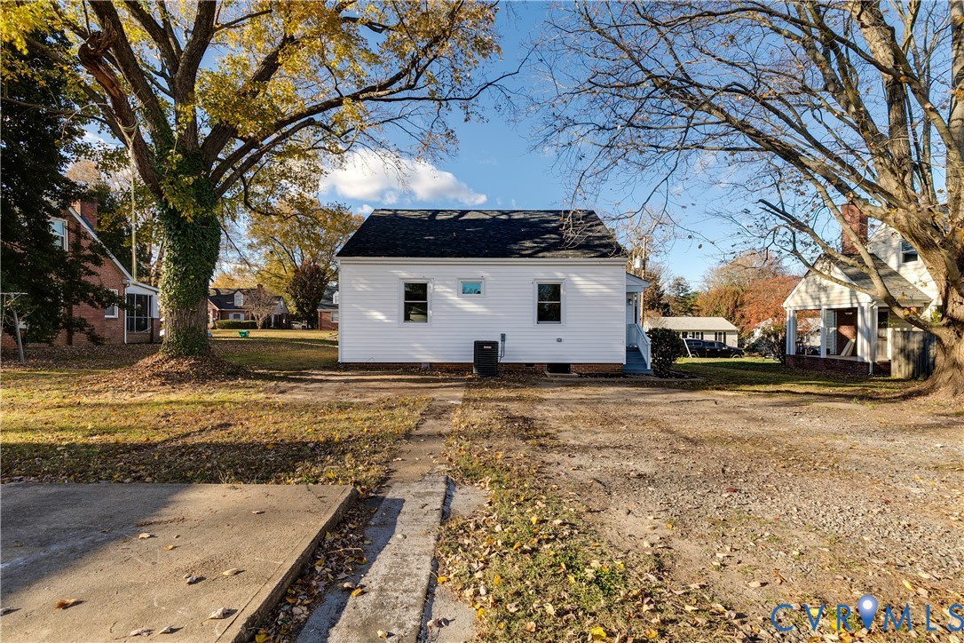 2207 Rawlings Street Henrico, VA 23231 - Photo 27 of 28 a view of a white house with a yard covered with snow