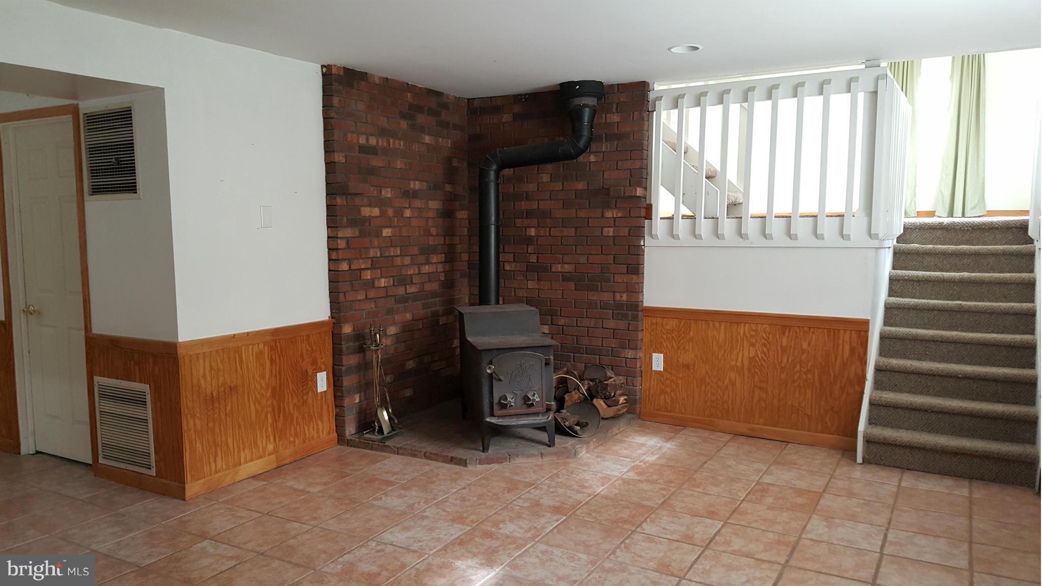 107 Bayview Road Chesapeake City, MD 21915 - Photo 15 of 24 LL with wood stove, family room?