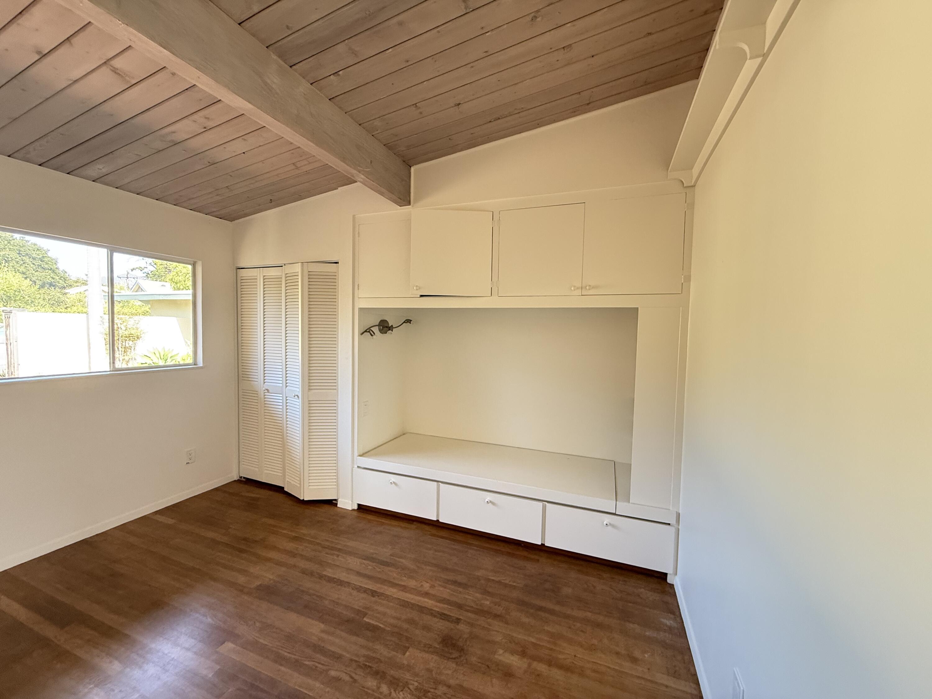 1747 Glen Oaks Drive Montecito, CA 93108 - Photo 14 of 24 a view of an empty room with wooden floor and a window