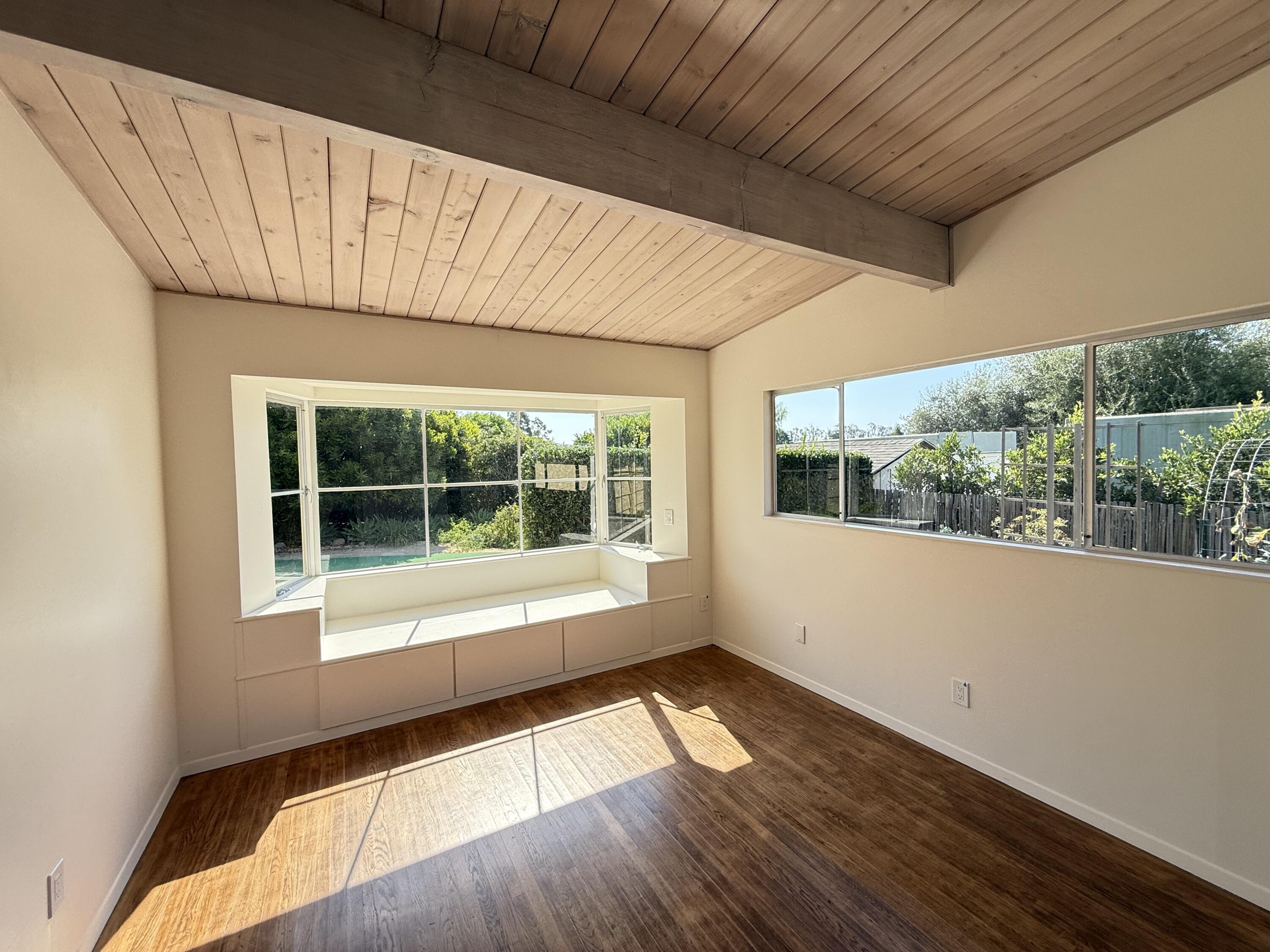 1747 Glen Oaks Drive Montecito, CA 93108 - Photo 15 of 24 a view of an empty room with wooden floor and a window
