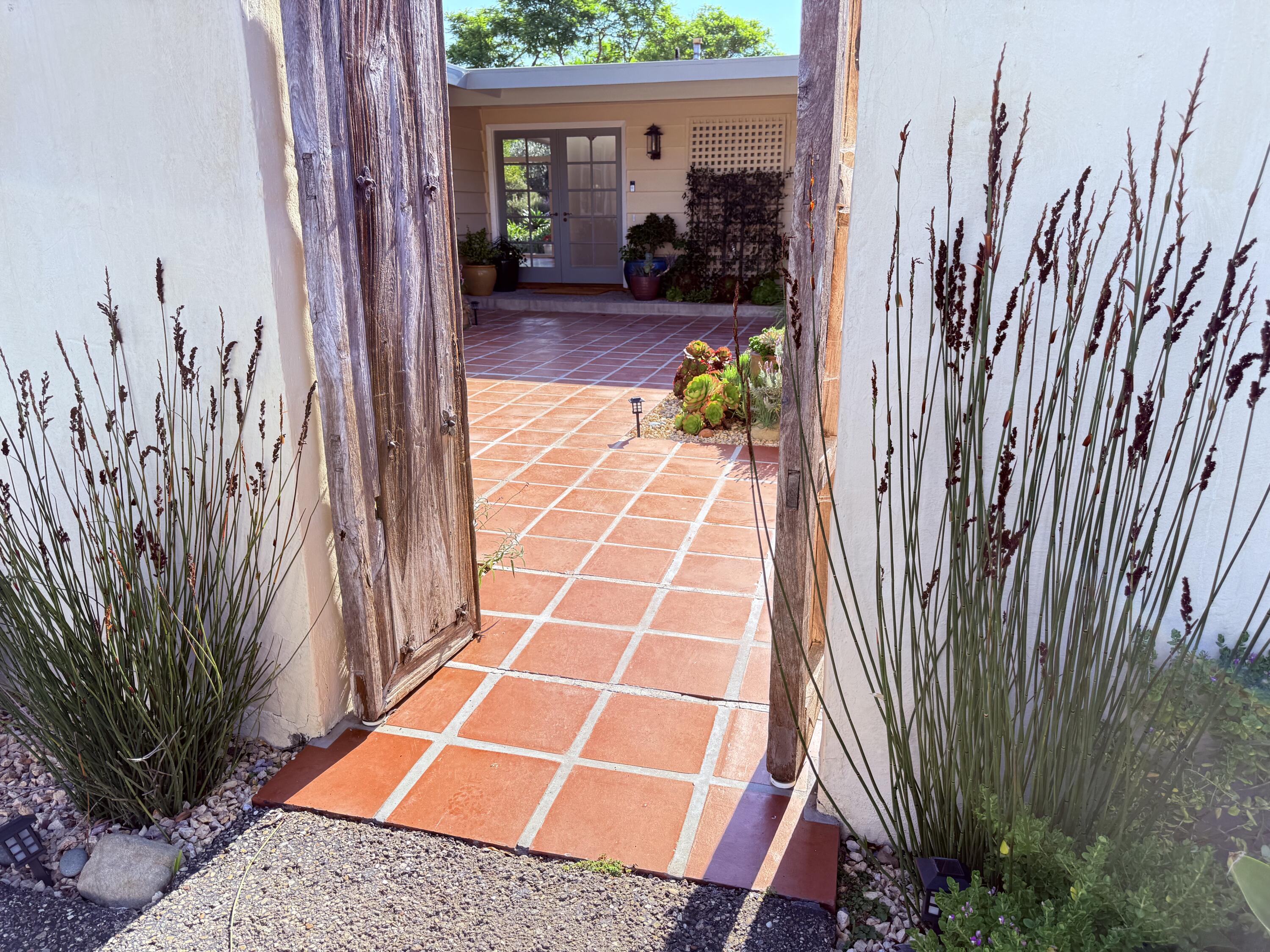 1747 Glen Oaks Drive Montecito, CA 93108 - Photo 2 of 24 a view of a backyard with chairs