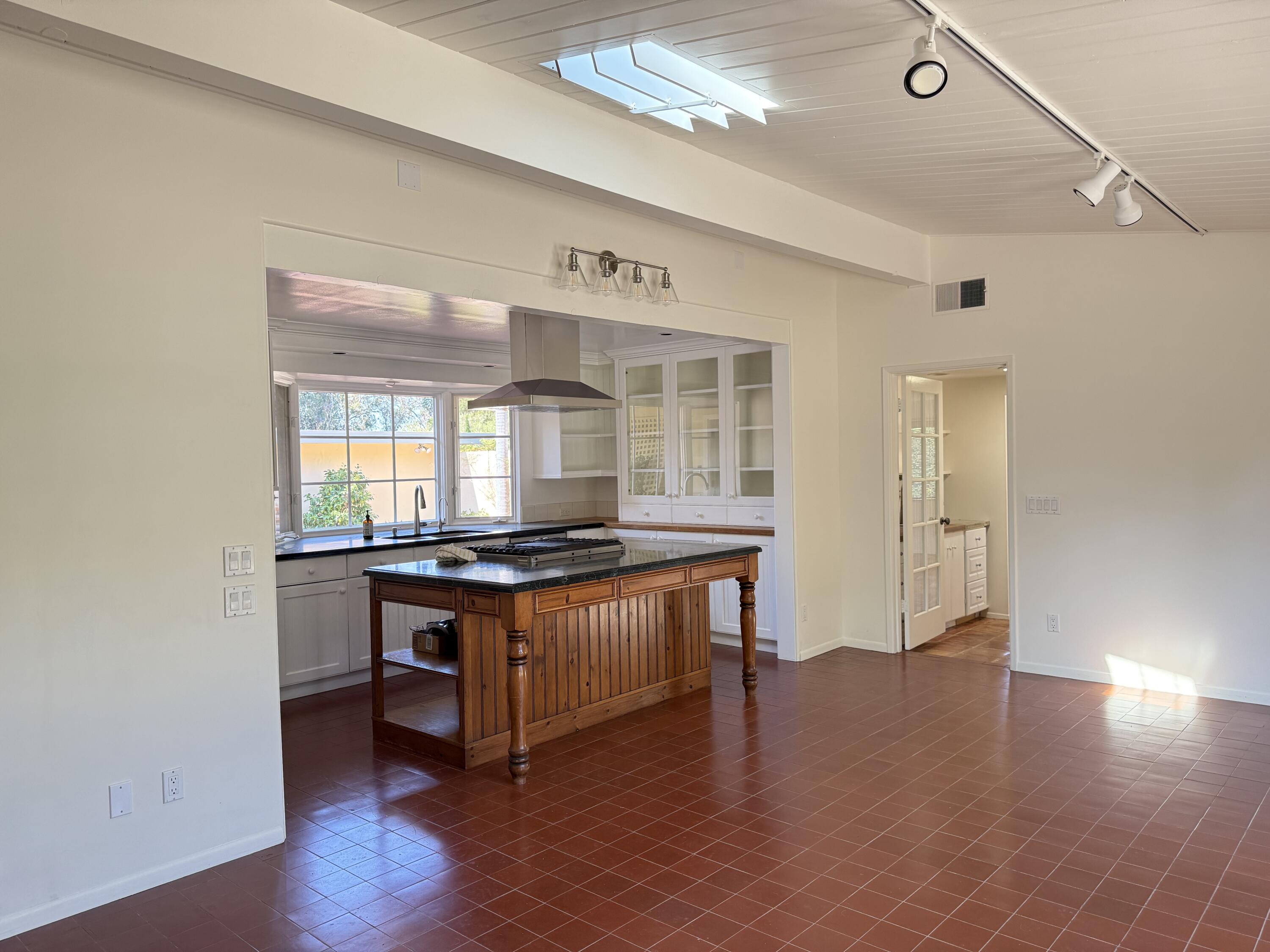 1747 Glen Oaks Drive Montecito, CA 93108 - Photo 9 of 24 a kitchen with stainless steel appliances granite countertop a stove and a refrigerator
