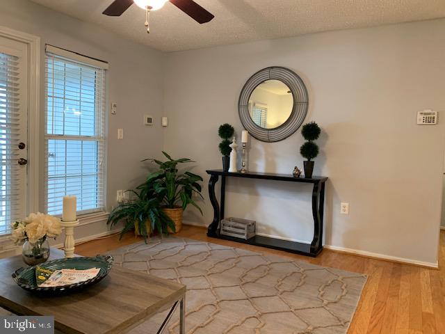 20960 Timber Ridge Terrace, Unit 101 Ashburn, VA 20147 - Photo 6 of 22 Hardwood flooring in the main living area