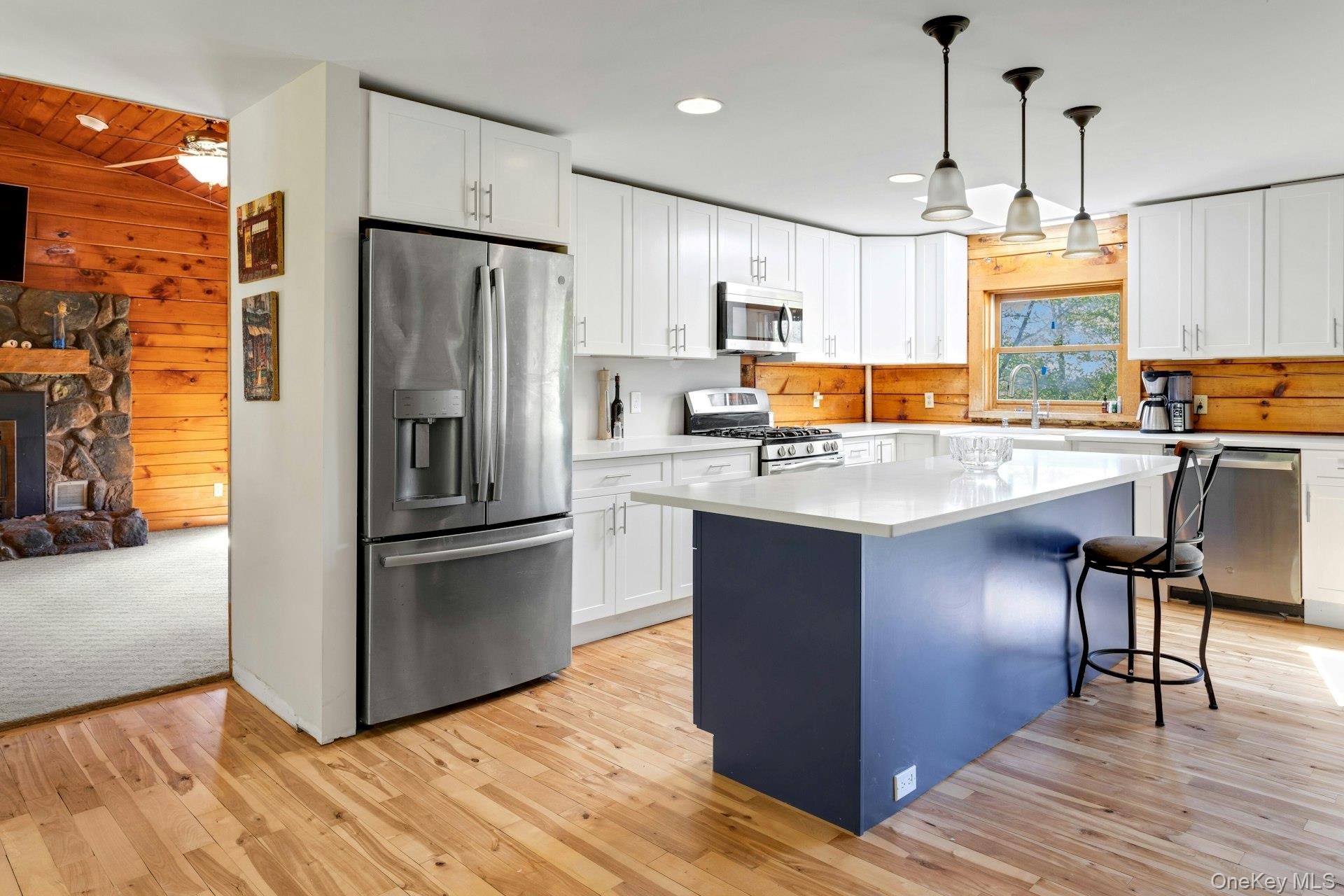 354 Sunset Hill Road East Fishkill, NY 12524 - Photo 12 of 31 a kitchen with kitchen island a counter top space a sink appliances and cabinets
