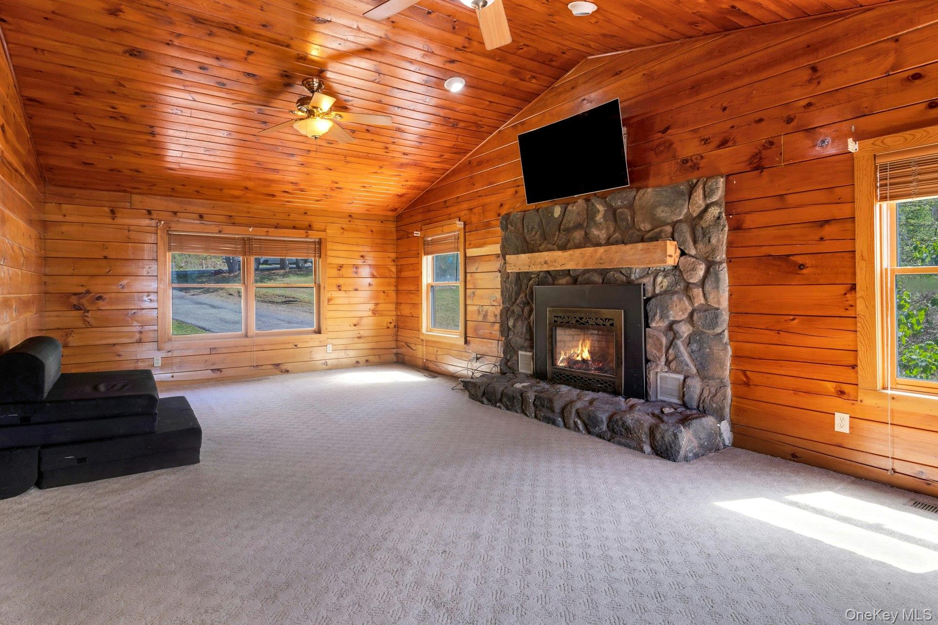354 Sunset Hill Road East Fishkill, NY 12524 - Photo 14 of 31 a living room with furniture and a fireplace