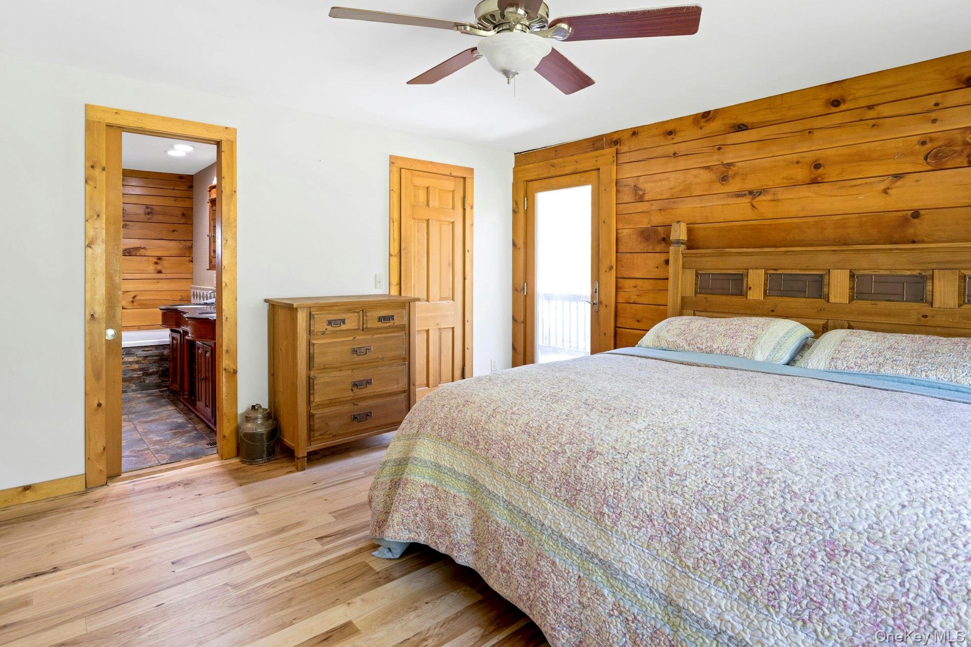 354 Sunset Hill Road East Fishkill, NY 12524 - Photo 17 of 31 a bedroom with a bed and wooden floor